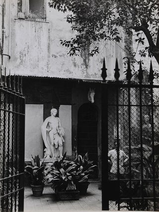 Item #6494 Statue behind gate with onlooker. (10.5" x 14"). Islay LYONS