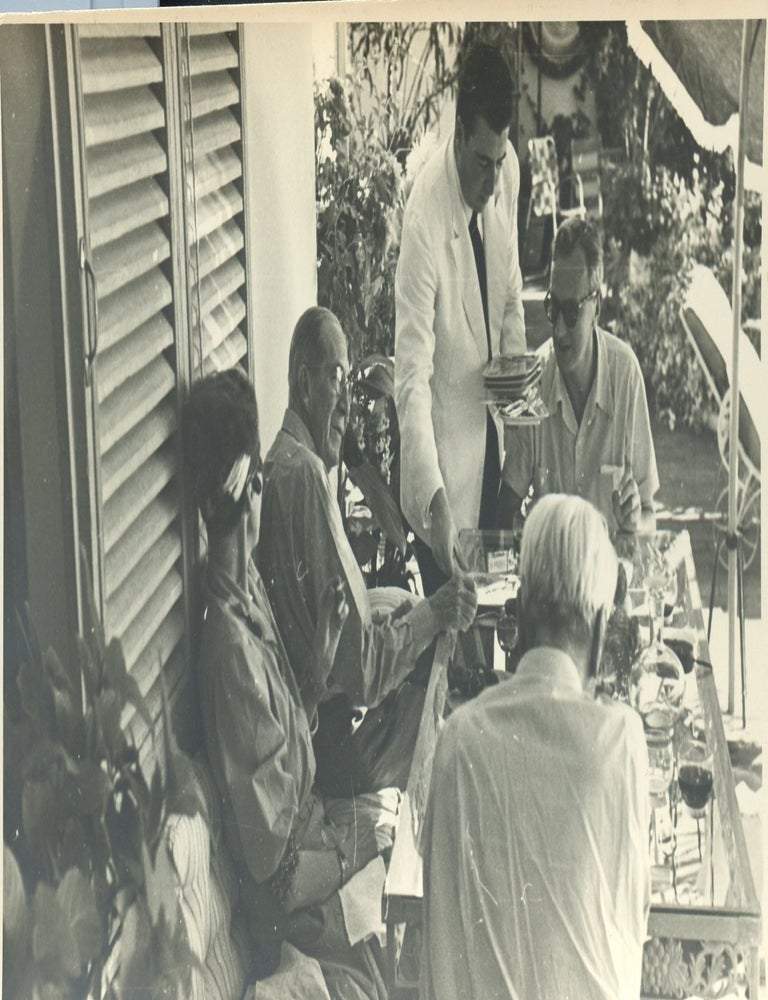 Item #8855 Vintage portrait of Nancy Cunard at lunch with Norman Douglas and Kenneth Macpherson at Macpherson's Capri home, circa 1950. Nancy CUNARD.